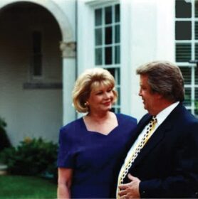 Pat and Milton in Front of Home