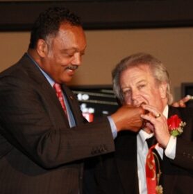 Jesse Jackson Feeding Milton McGregor Cake at VictoryLand