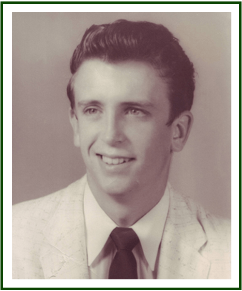 a man wearing a suit and tie smiling at the camera